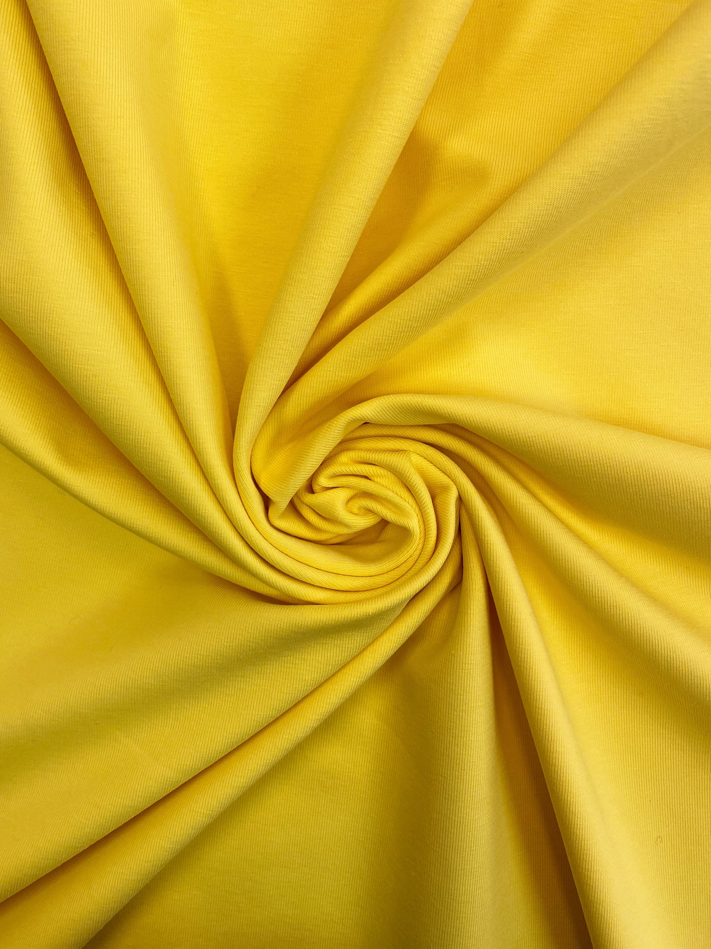 Auringonkeltainen puuvillatrikoo